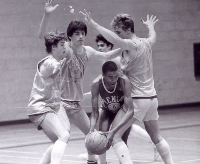 The Knights' John Paye, Eric Reveno and Dave Dove trap teammate Jervis Williams in a scrimmage